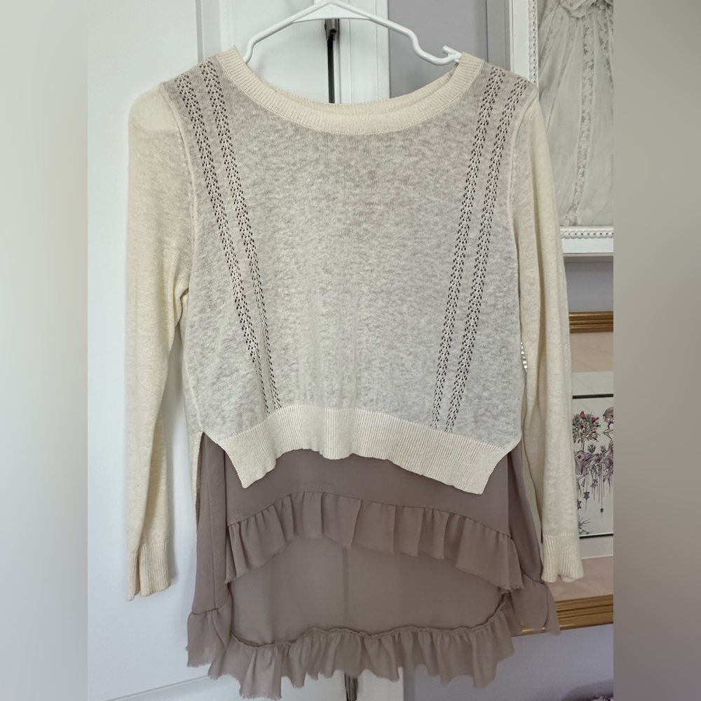 Adorable light weight cream sweater / lined with long ruffled shear shirt.
